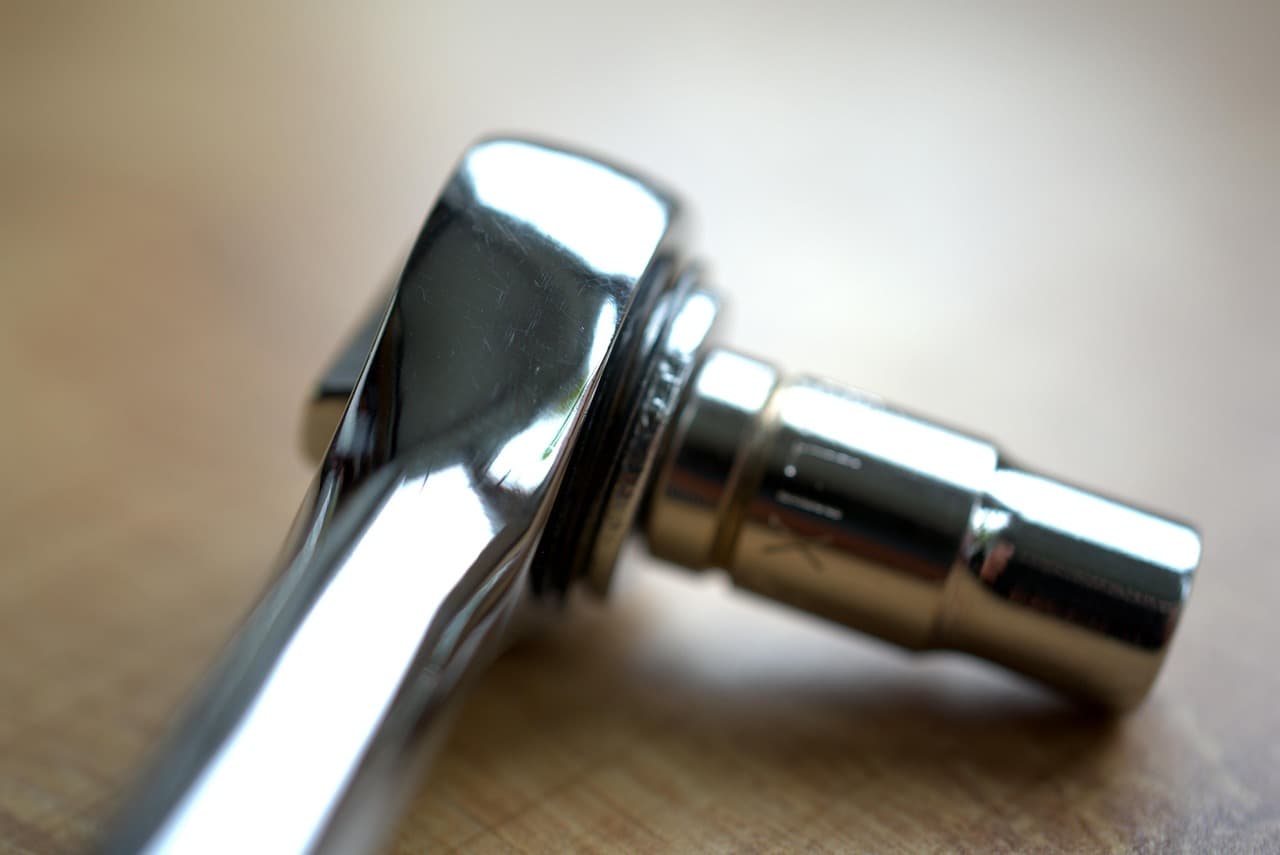 A ratchet and socket on the workbench